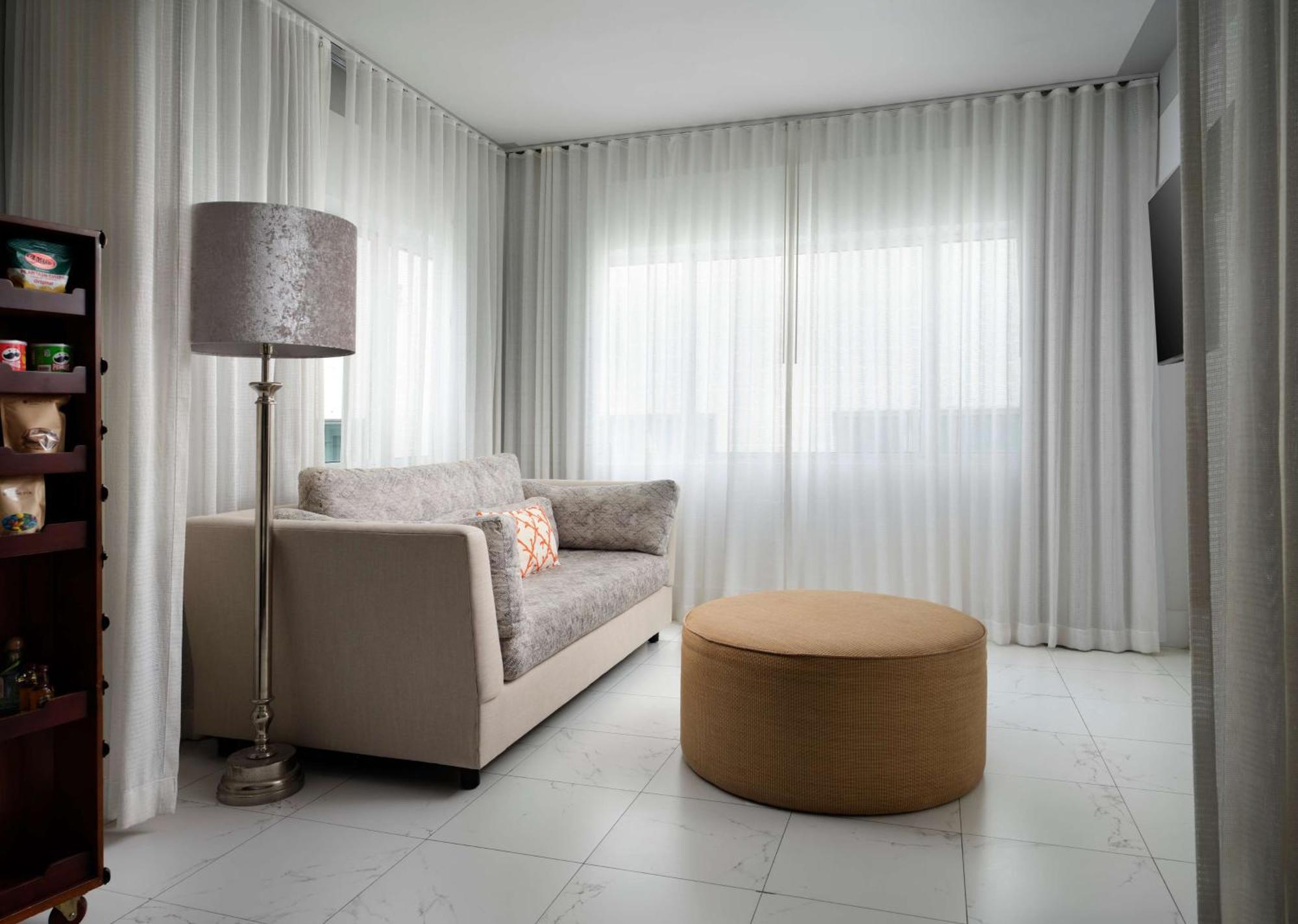 Nautilus Sonesta Miami Beach Exterior photo A living room with curtains